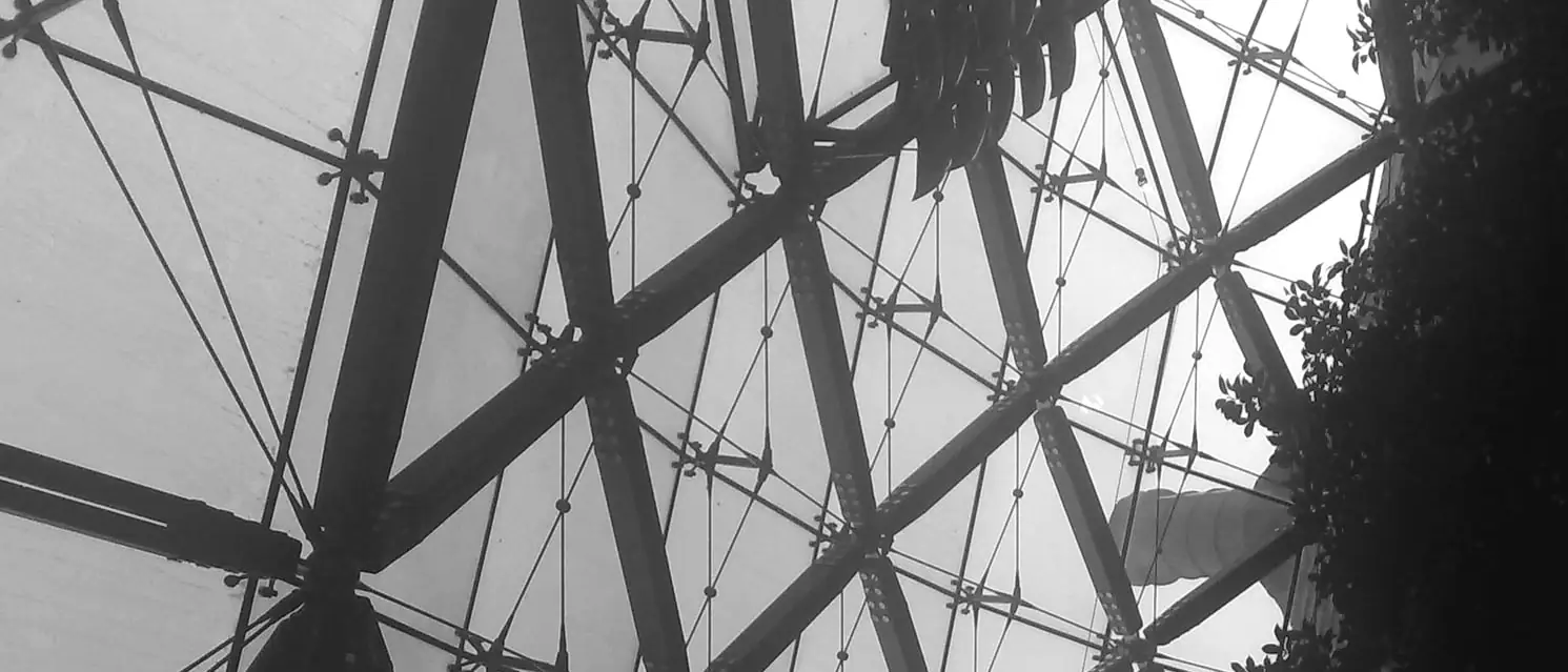 The steel and glass lattice of the Portcullis House courtyard roof, seen from below