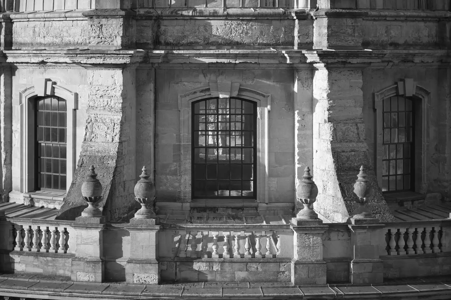 Windows, urns and a stone balustrade on the upper drum of the Radcliffe Camera