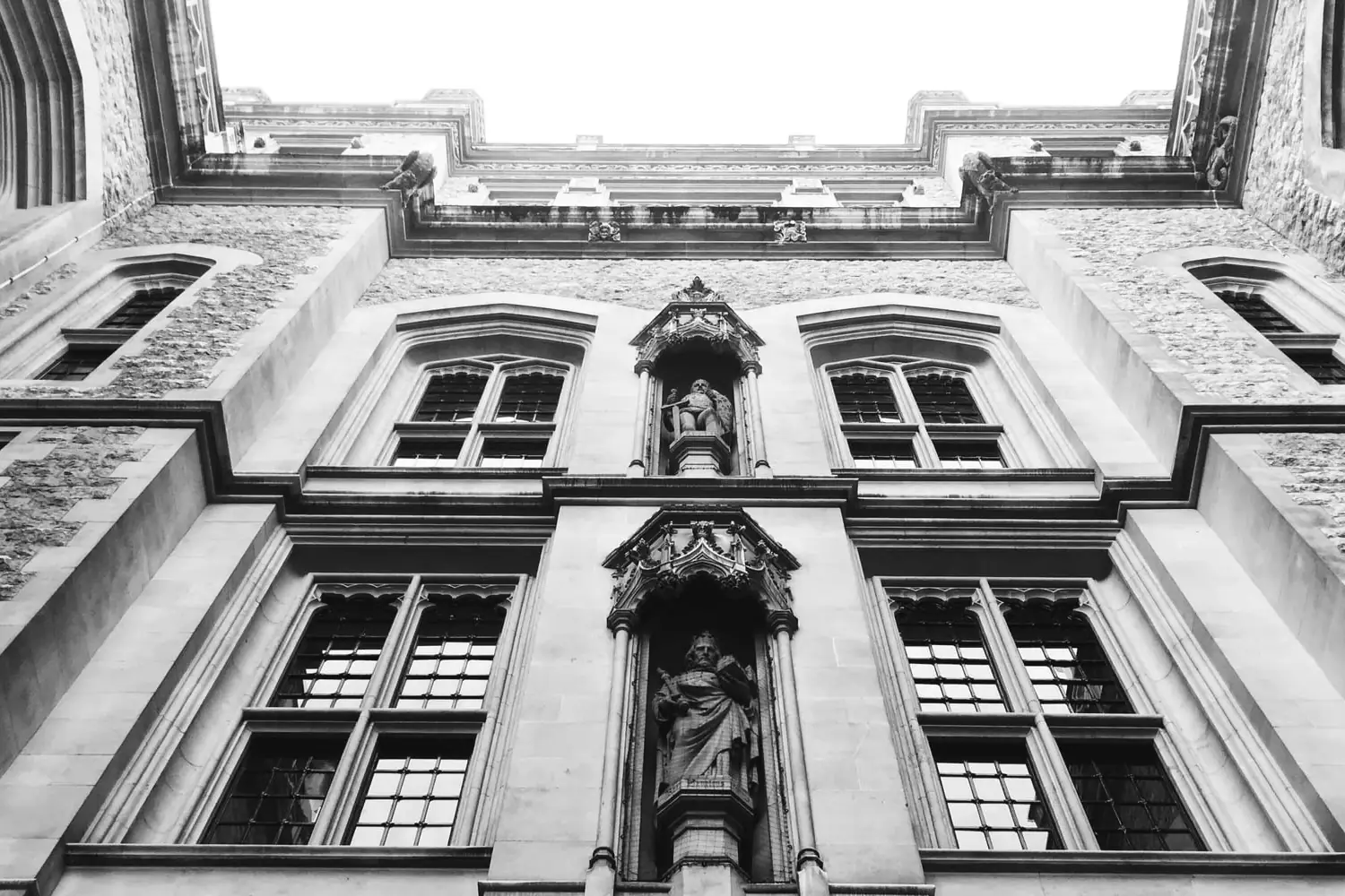 The carved stone front of the Maughan Library in London, seen from below